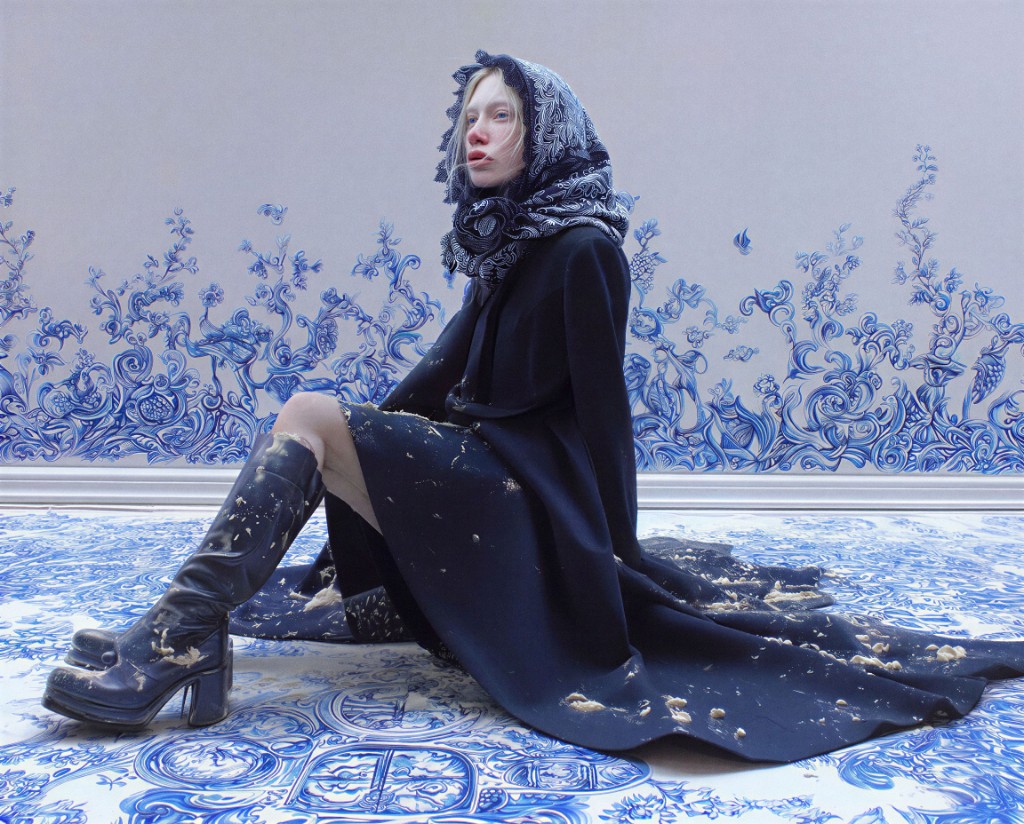 Woman in a blue-and-white Delft headscarf and dark coat on patterned tile