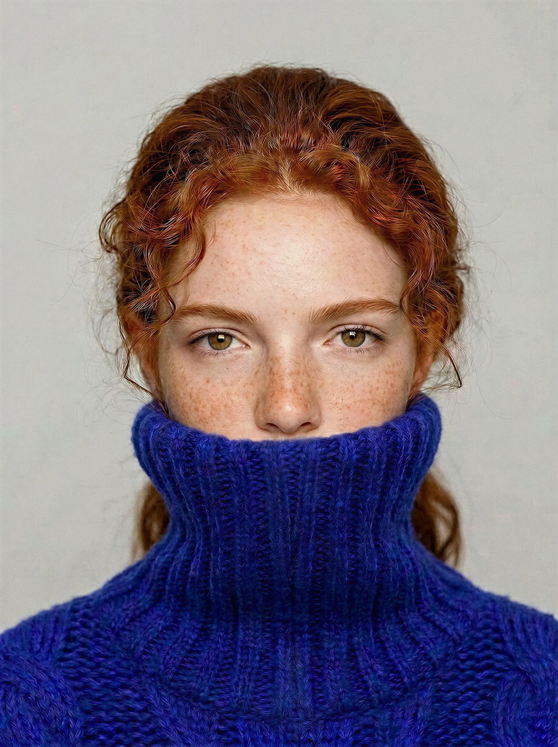 Blue-toned headshot portrait